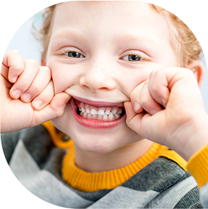 little girl showing teeth