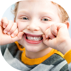 little girl showing teeth